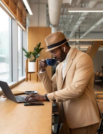 modern-man-doing-business-caffe_23-2148956932
